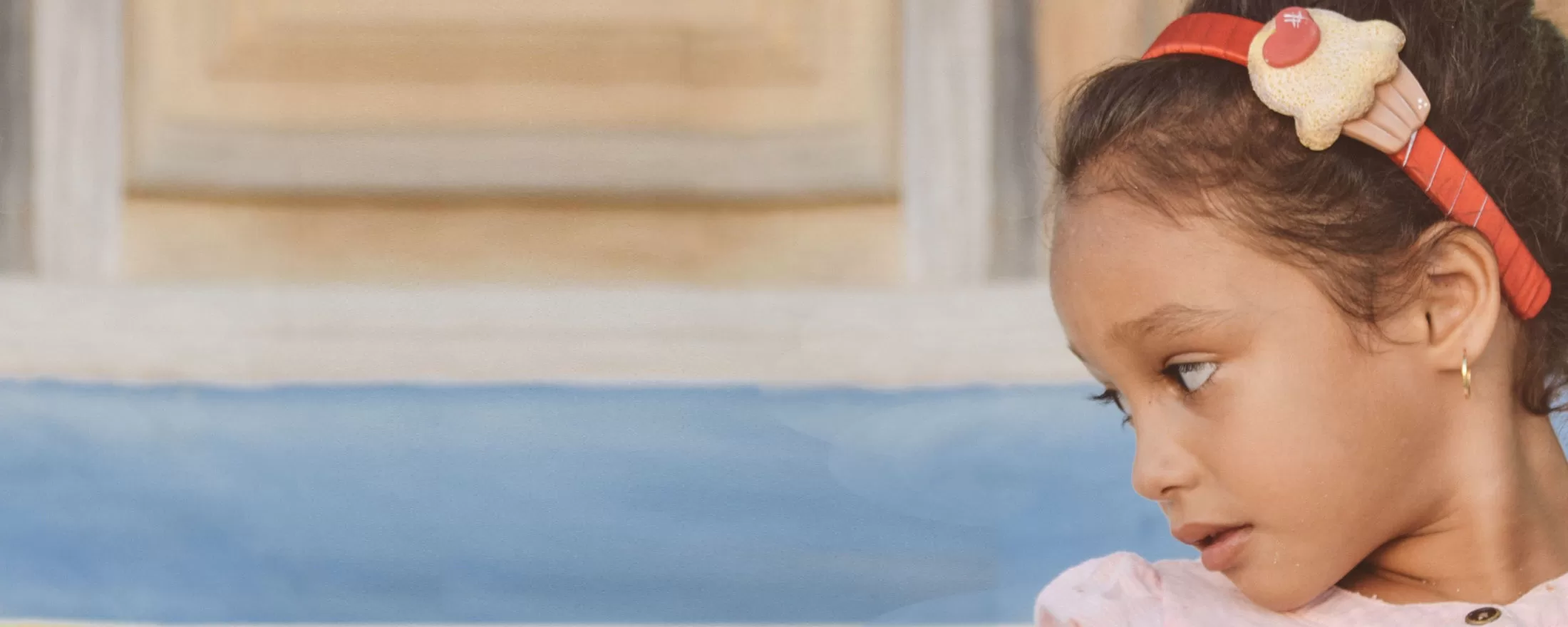 Girl in headband looking worried